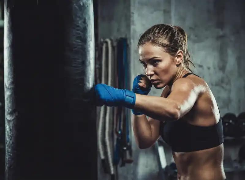 Female boxer training - martial arts club management software